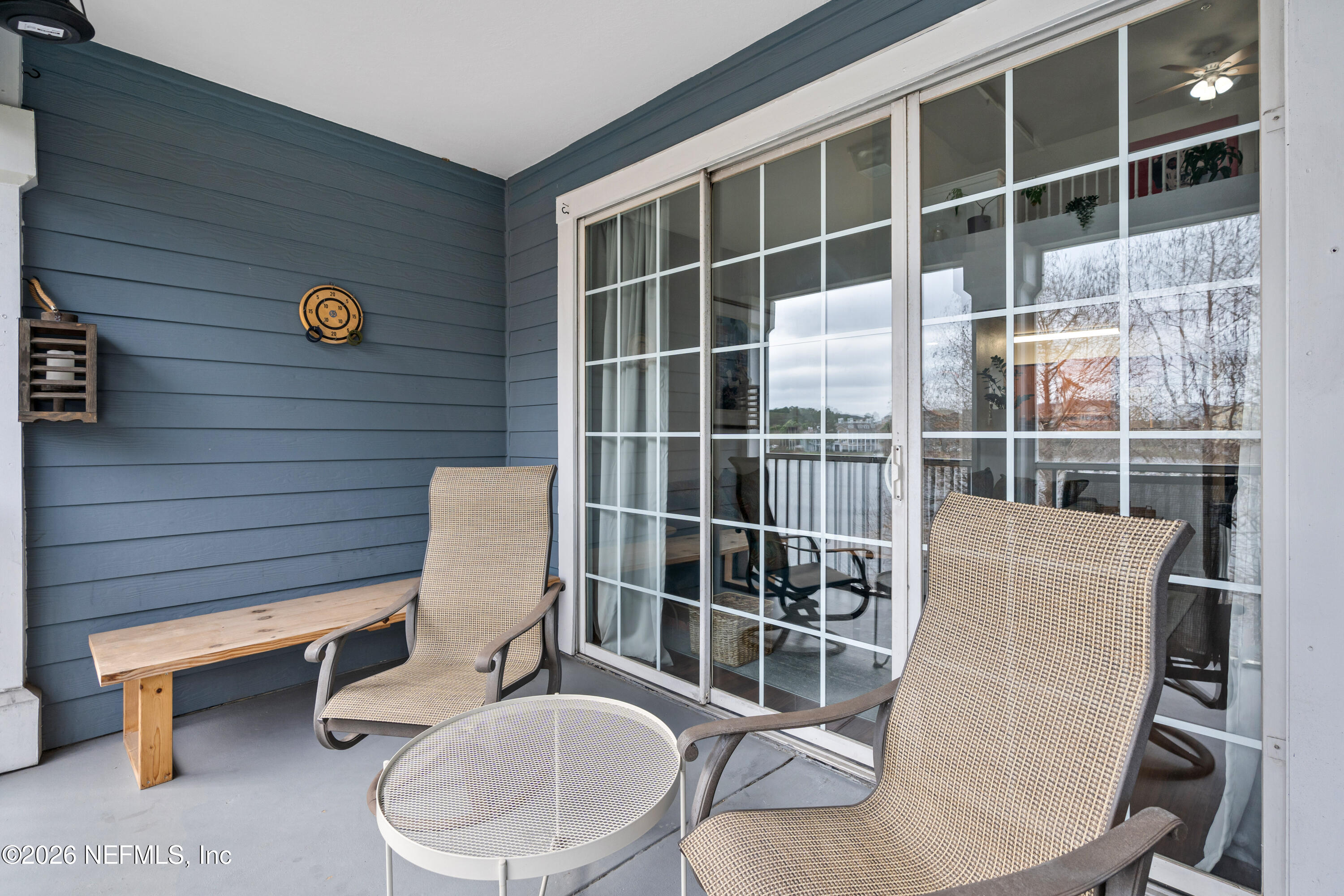 8550 Touchton Road, Unit 1034 Jacksonville, FL 32216 - Photo 24 of 30 a bathroom with a toilet a sink and mirror