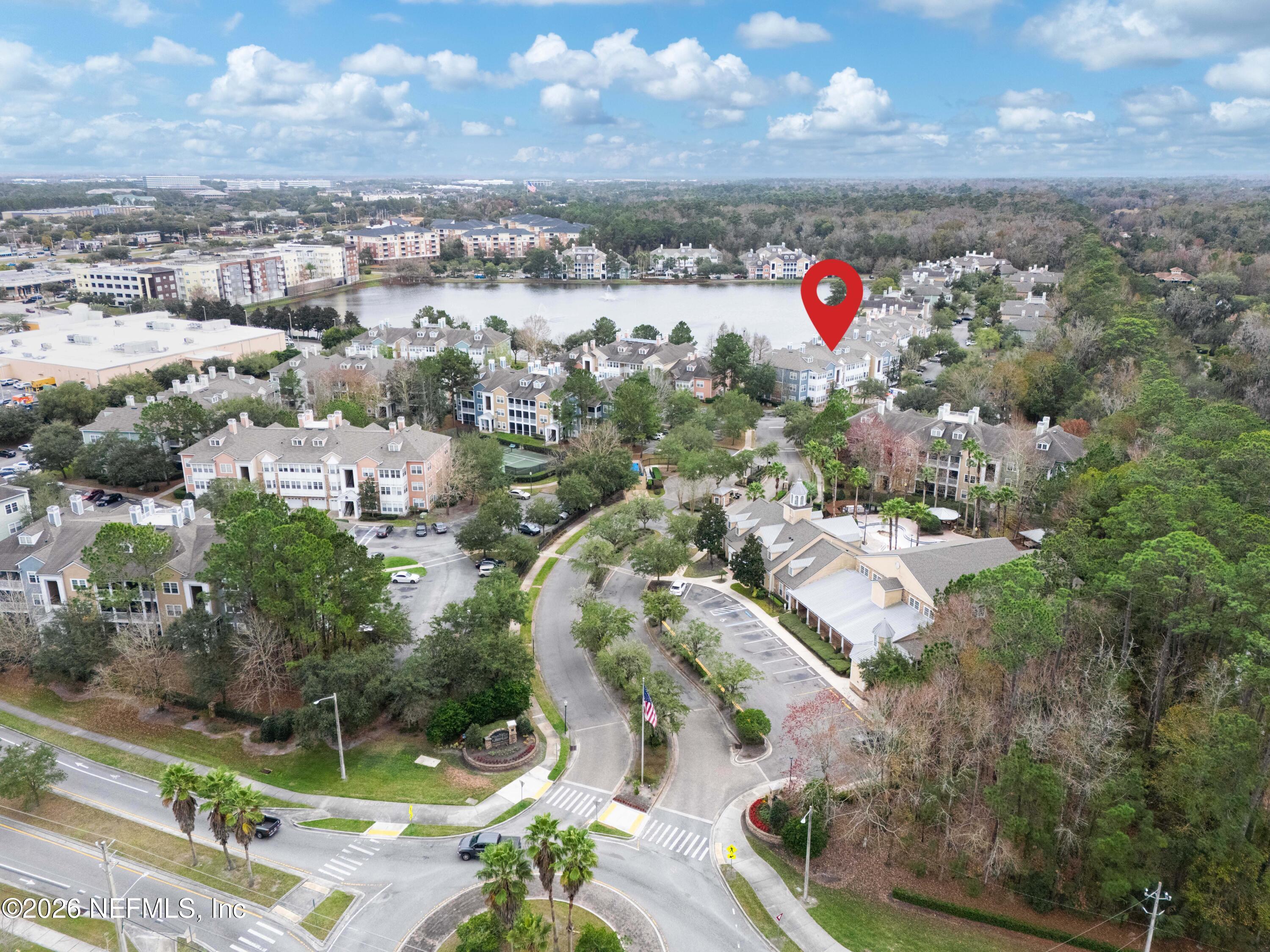 8550 Touchton Road, Unit 1034 Jacksonville, FL 32216 - Photo 26 of 30 an aerial view of residential houses with outdoor space