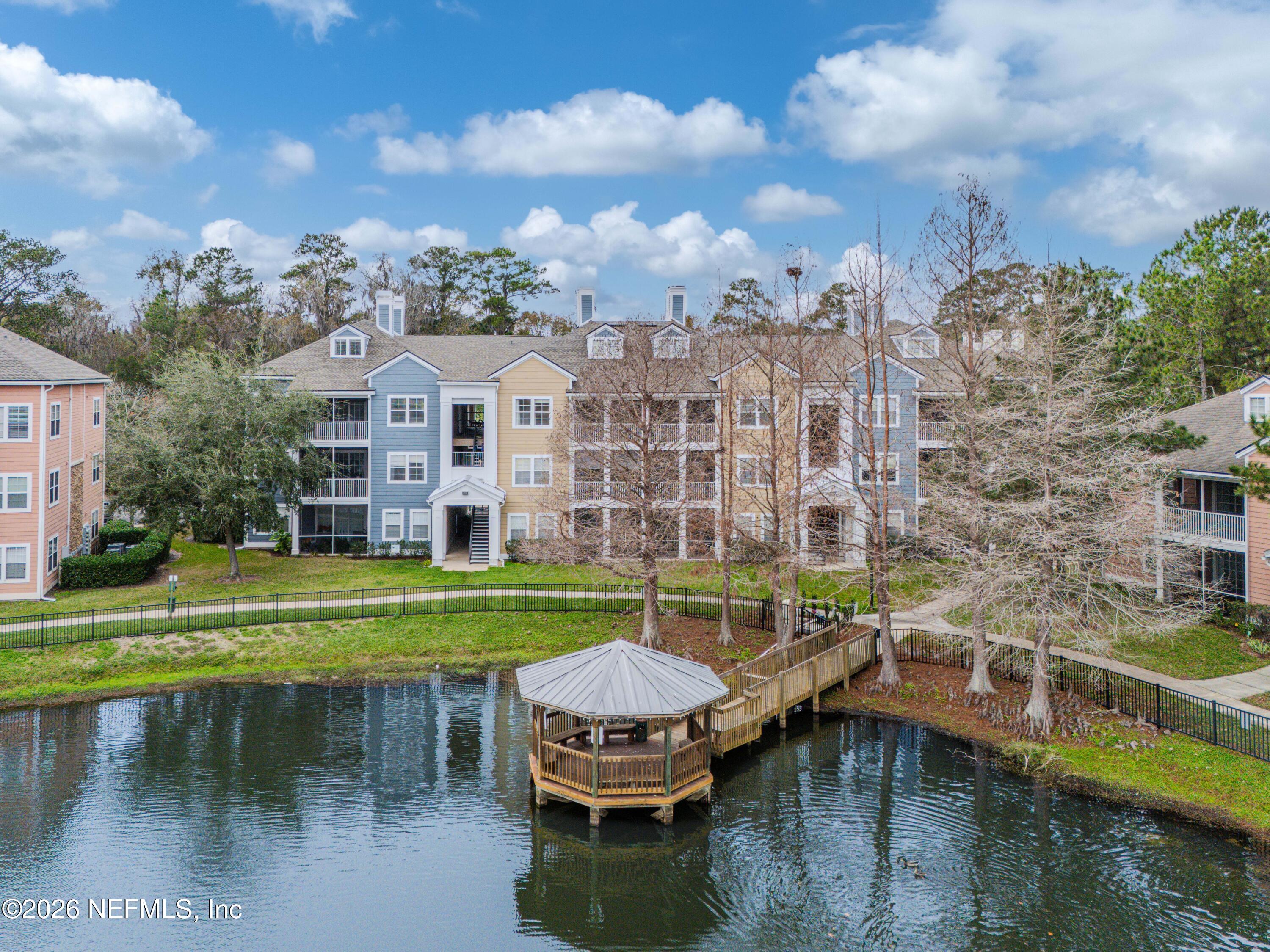 8550 Touchton Road, Unit 1034 Jacksonville, FL 32216 - Photo 29 of 30 a view of a swimming pool with a lounge chairs