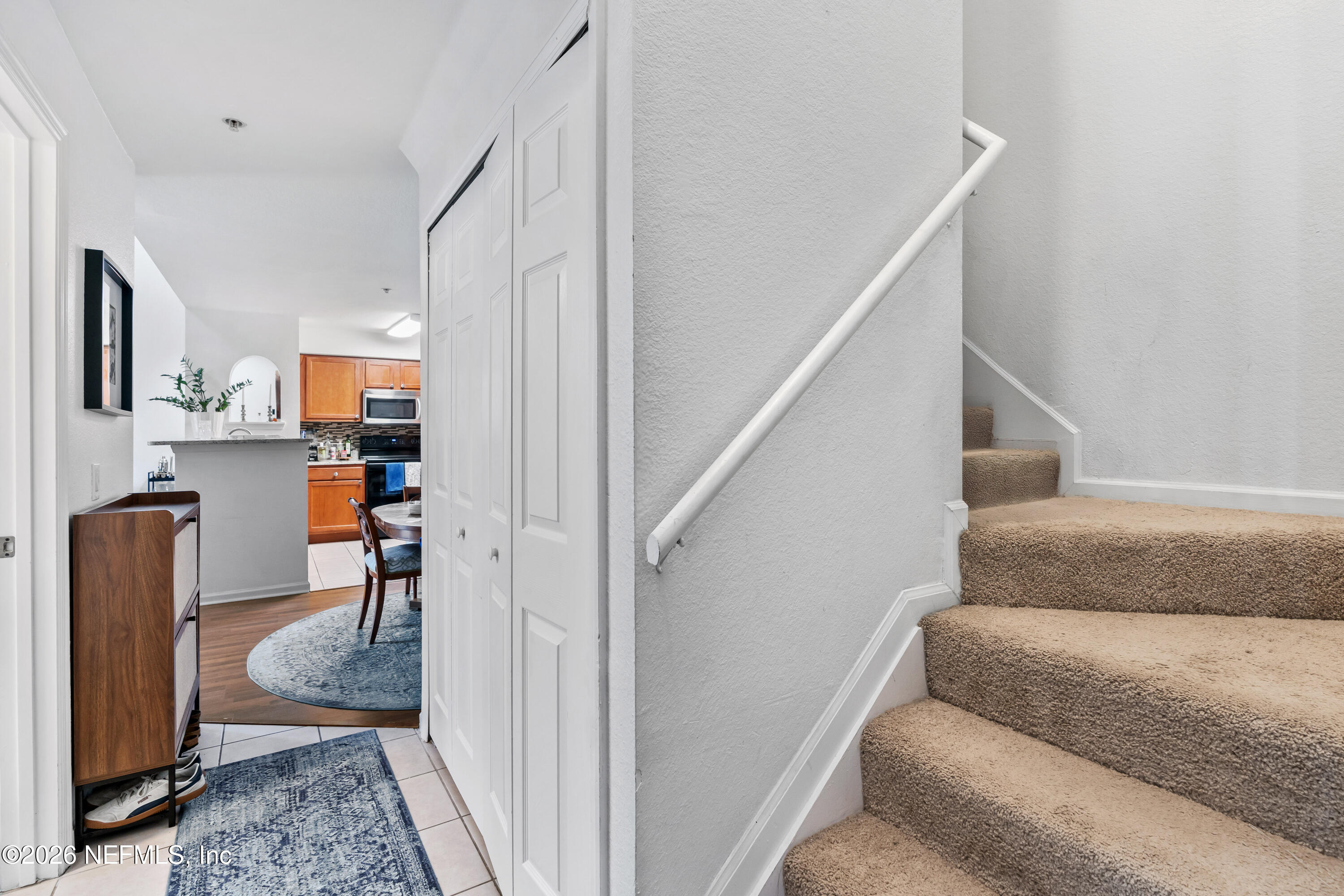 8550 Touchton Road, Unit 1034 Jacksonville, FL 32216 - Photo 4 of 30 a living room with furniture and a rug