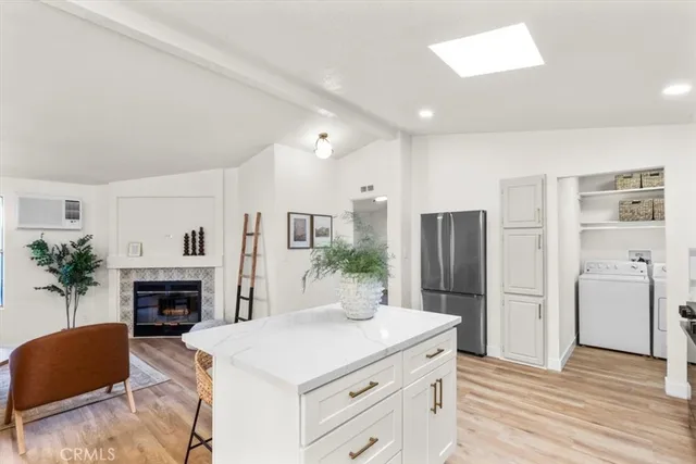 a living room with furniture a fireplace and a table