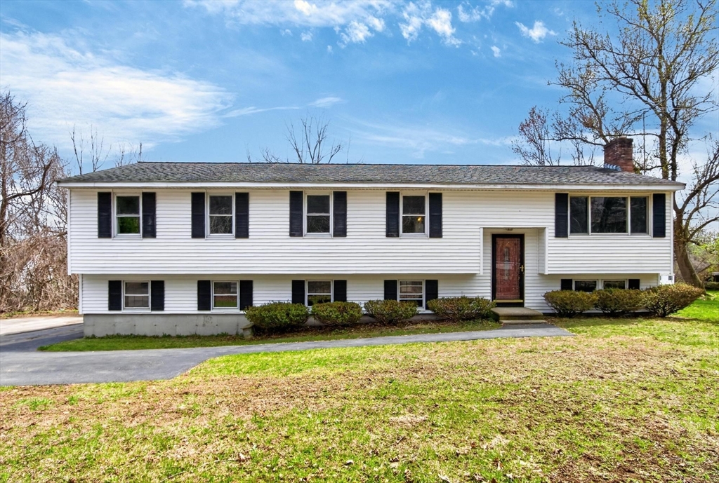73 Nashua Road Pepperell, MA 01463 - Photo 1 of 33 a front view of a house with a yard