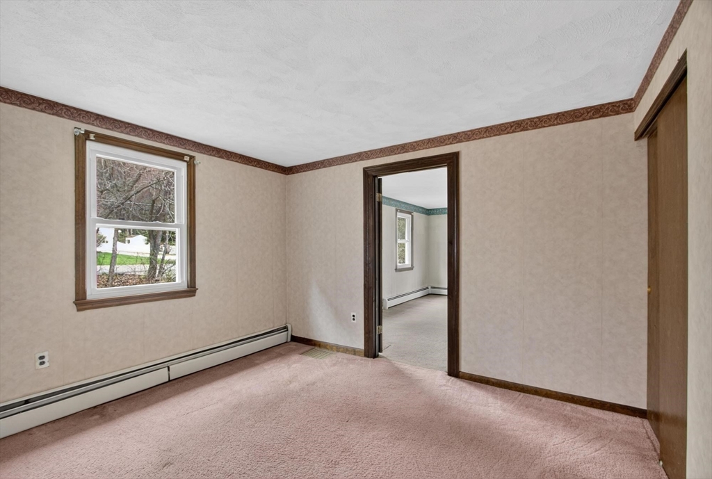73 Nashua Road Pepperell, MA 01463 - Photo 12 of 33 a view of an empty room and window
