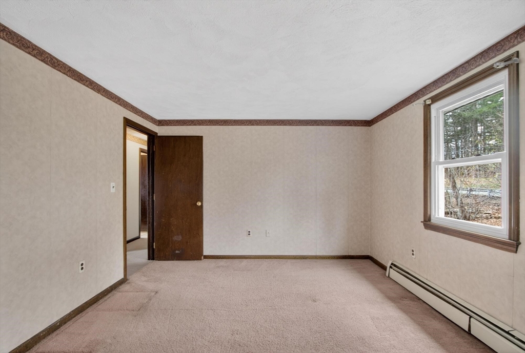 73 Nashua Road Pepperell, MA 01463 - Photo 13 of 33 a view of an empty room with a window