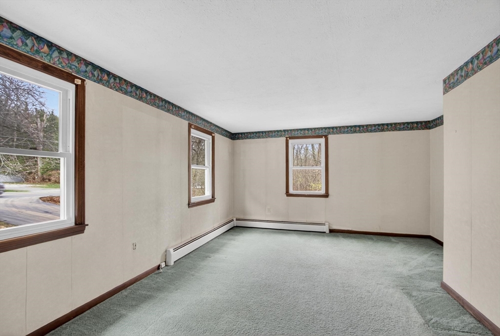 73 Nashua Road Pepperell, MA 01463 - Photo 16 of 33 an empty room with windows