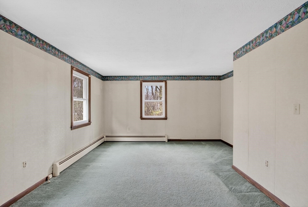 73 Nashua Road Pepperell, MA 01463 - Photo 17 of 33 a view of an empty room with a window