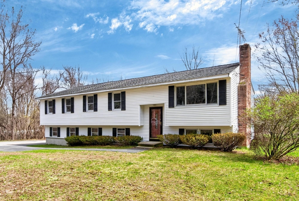 73 Nashua Road Pepperell, MA 01463 - Photo 2 of 33 a house that has a big yard in front of it