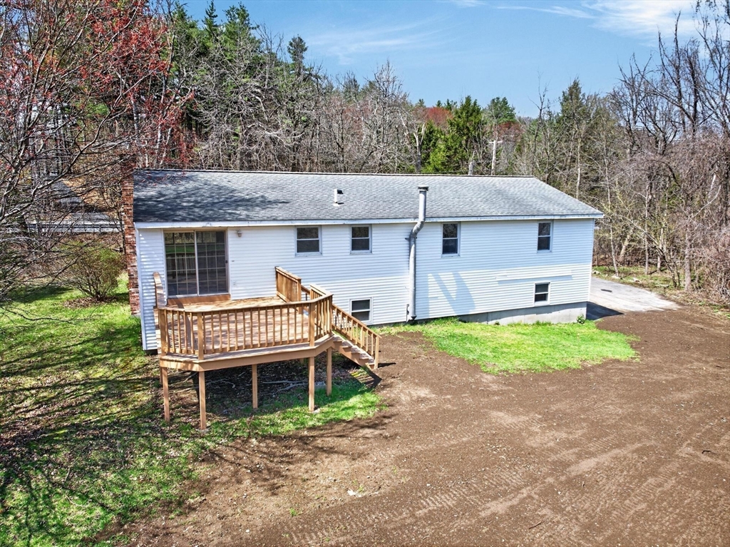 73 Nashua Road Pepperell, MA 01463 - Photo 23 of 33 a aerial view of a house with a yard