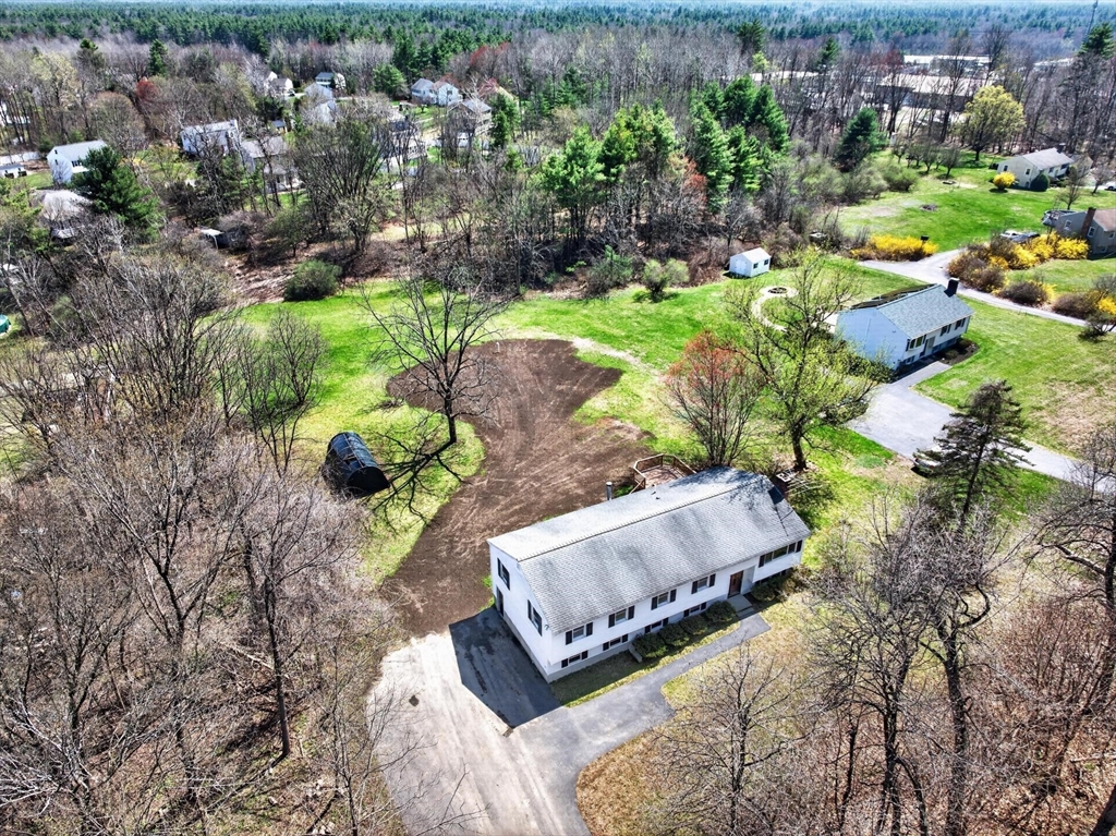 73 Nashua Road Pepperell, MA 01463 - Photo 30 of 33 a garden with lots of trees and flowers