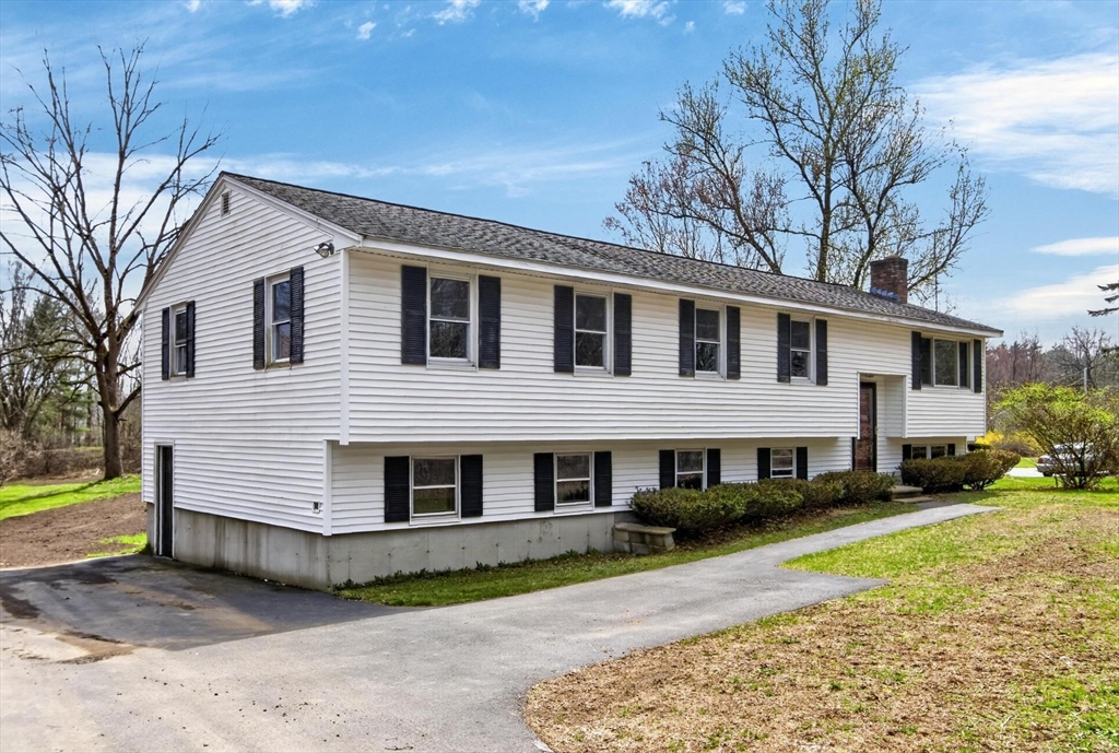 73 Nashua Road Pepperell, MA 01463 - Photo 3 of 33 a front view of a house with a yard
