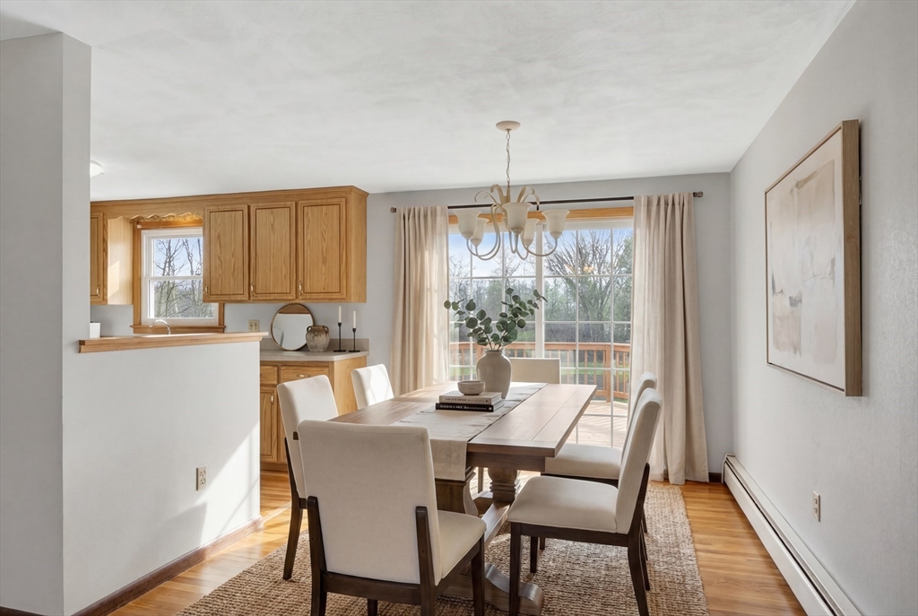 73 Nashua Road Pepperell, MA 01463 - Photo 9 of 33 a view of a dining room with furniture window and wooden floor