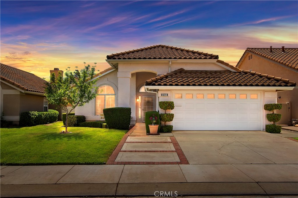 5148 Riviera Avenue Banning, CA 92220 - Photo 1 of 1 a front view of a house with a yard and garage