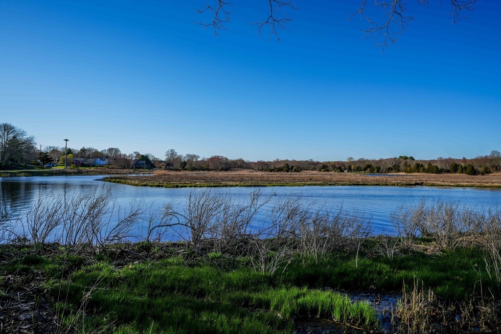 44 Old Harbor Road Westport, MA 02790 - Photo 15 of 26 a view of a lake with houses in the back