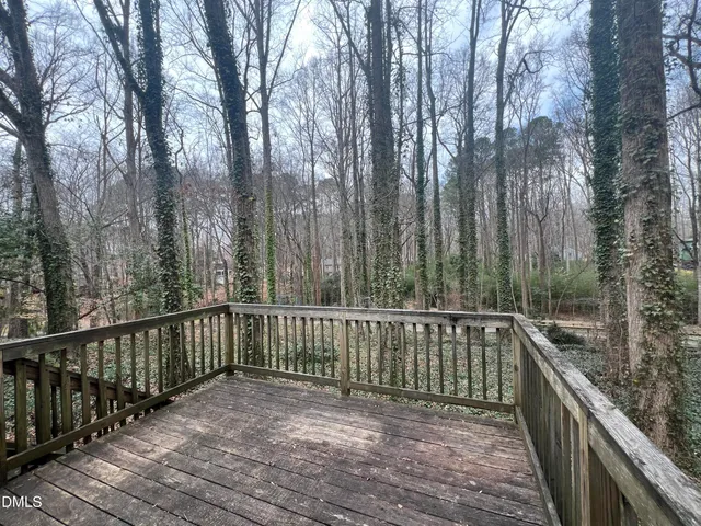 a view of a balcony with wooden floor