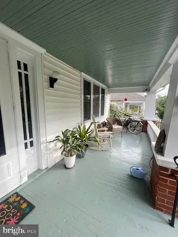 a lobby with furniture and a potted plant