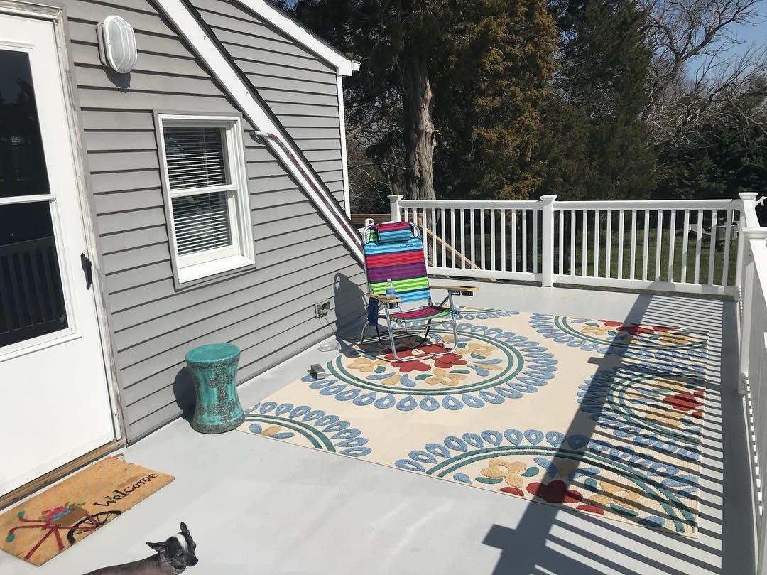 33 Stanhope Road Marmora, NJ 08223 - Photo 17 of 22 a balcony with table and chairs