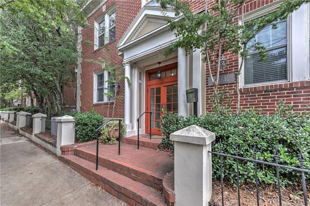 733 Frederica Street Northeast, Unit 2 Atlanta, GA 30306 - Photo 11 of 11 a front view of a house with a garden