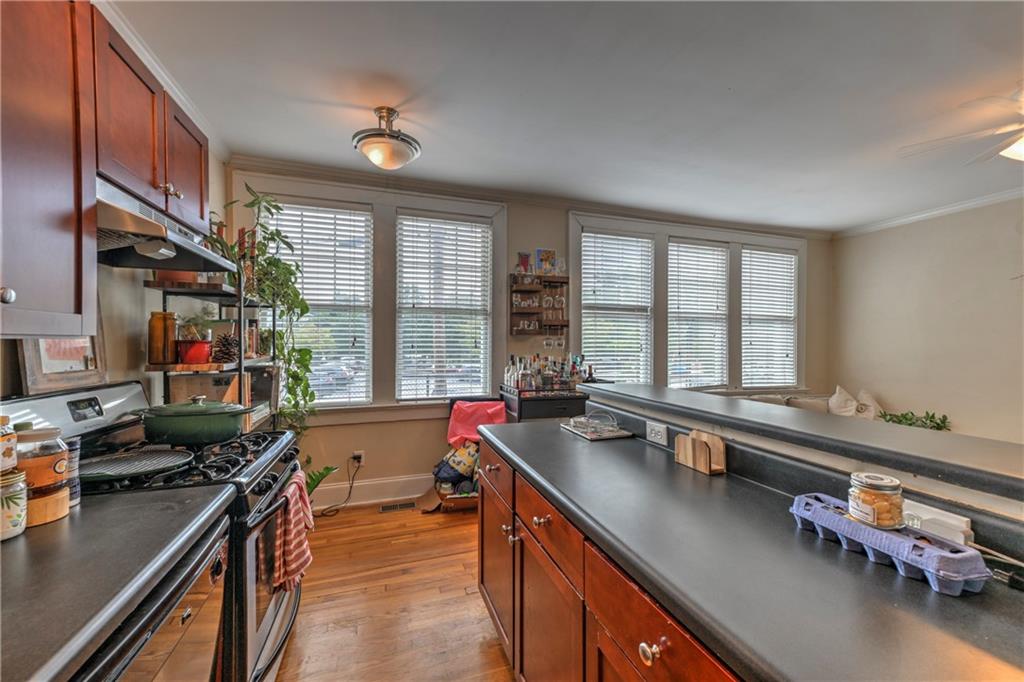 733 Frederica Street Northeast, Unit 2 Atlanta, GA 30306 - Photo 2 of 11 a kitchen with a large window and a sink