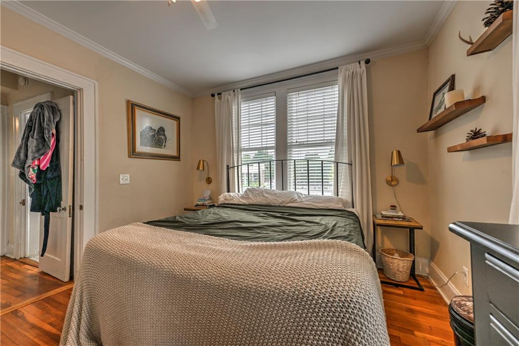 733 Frederica Street Northeast, Unit 2 Atlanta, GA 30306 - Photo 8 of 11 a bedroom with a bed and a window
