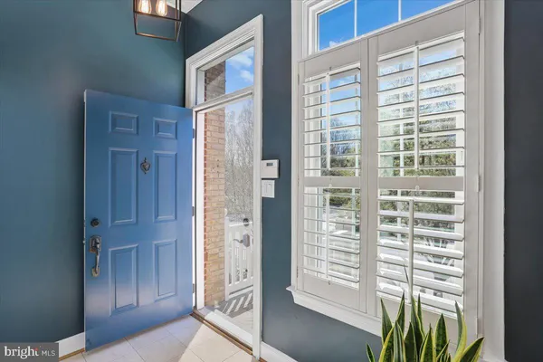 a view of a closet area with wooden floor