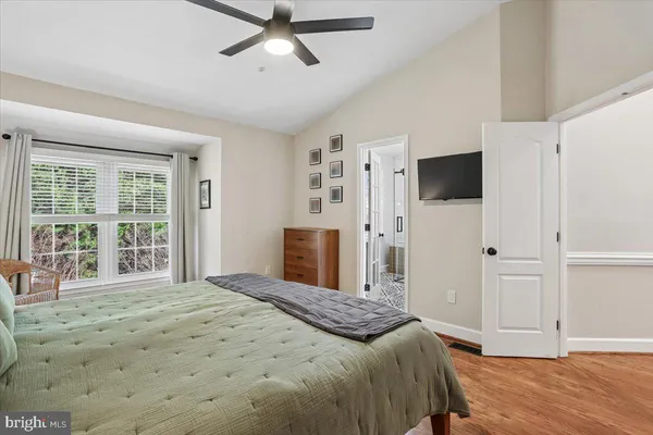a view of a balcony with furniture and floor to ceiling window
