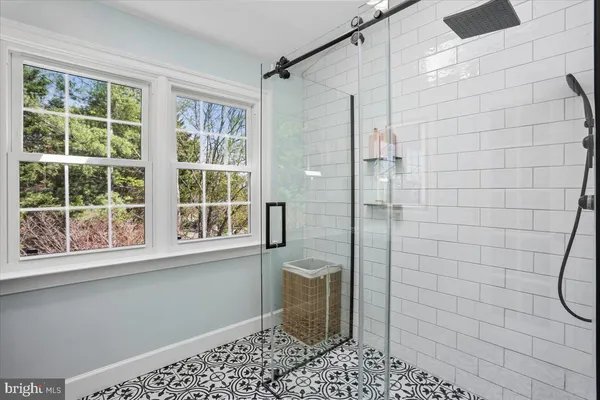 a room with a sink and a mirror