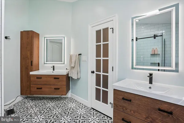 a bathroom with a granite countertop sink a toilet and a bathtub