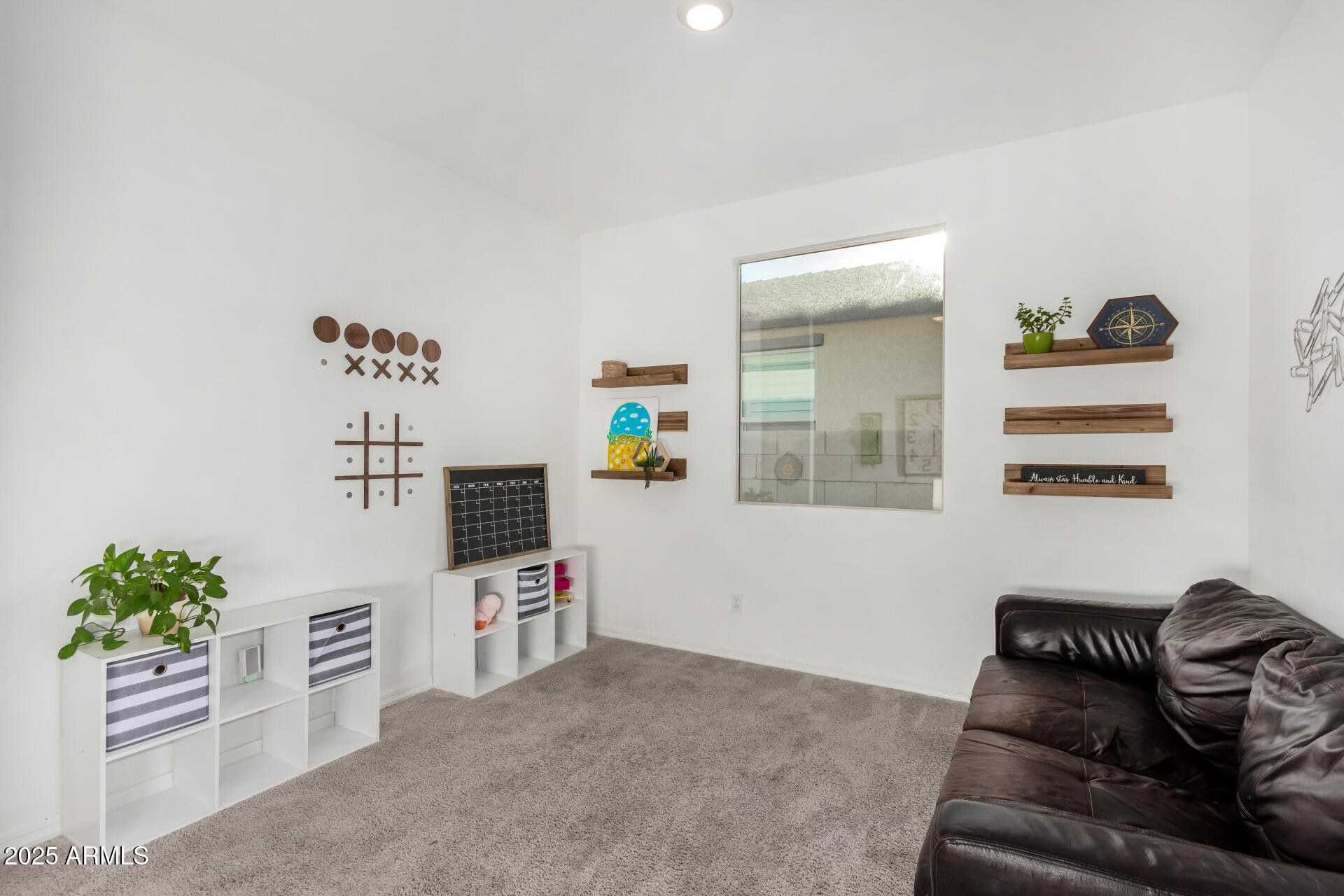 11517 East Unity Avenue Mesa, AZ 85212 - Photo 12 of 48 a living room with furniture and a potted plant