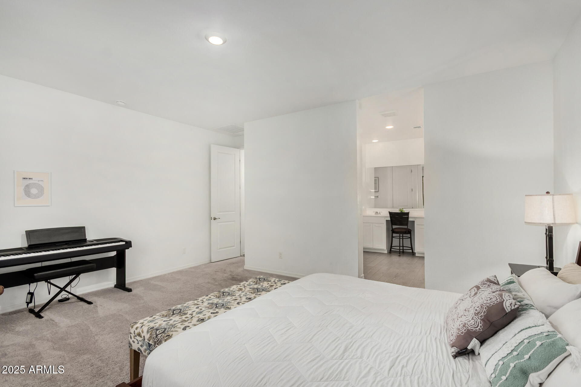 11517 East Unity Avenue Mesa, AZ 85212 - Photo 16 of 48 a bedroom with a bed and a piano in it