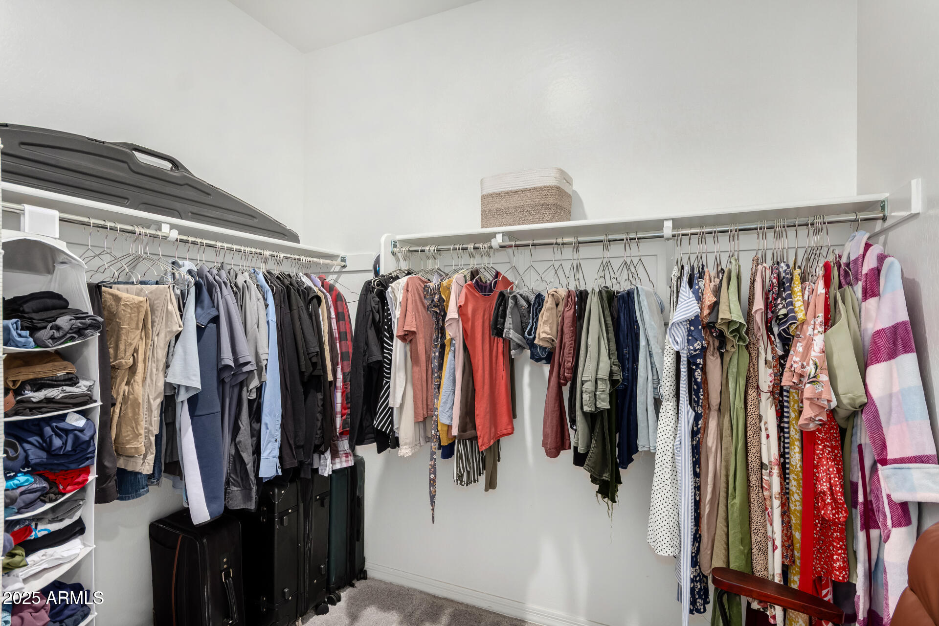 11517 East Unity Avenue Mesa, AZ 85212 - Photo 20 of 48 a view of walk in closet with clothes