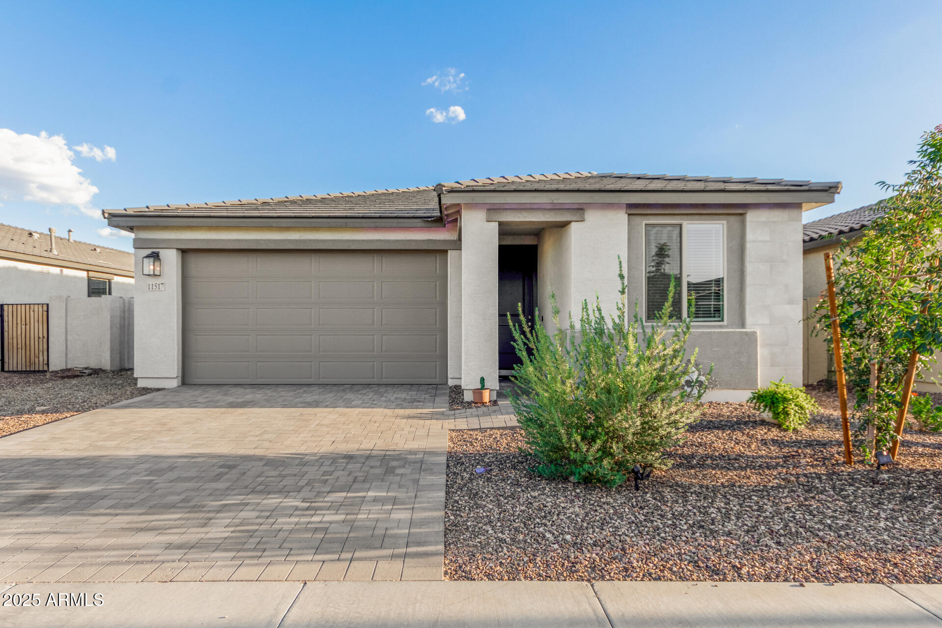 11517 East Unity Avenue Mesa, AZ 85212 - Photo 2 of 48 a front view of a house with garden