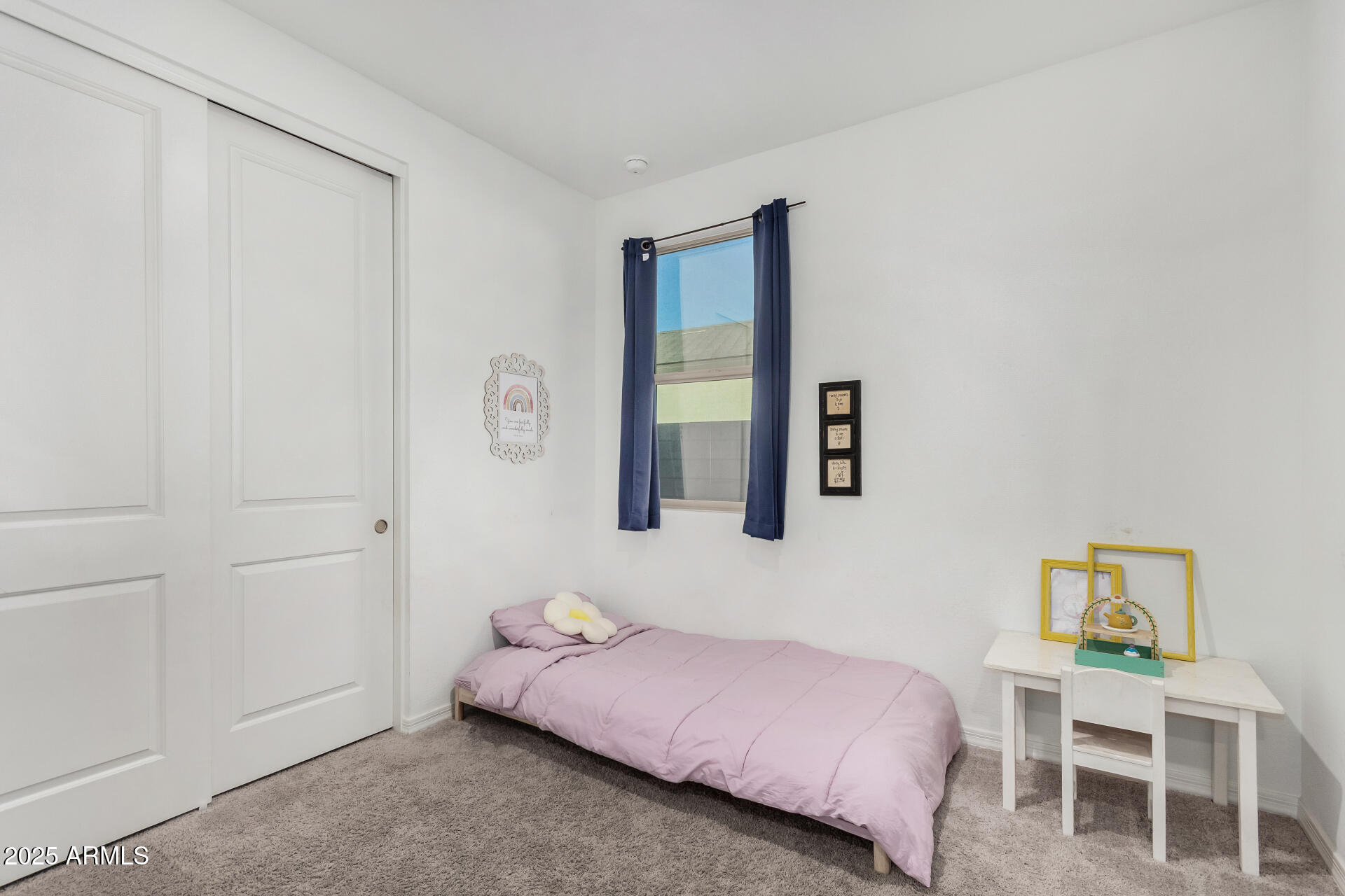 11517 East Unity Avenue Mesa, AZ 85212 - Photo 23 of 48 a bedroom with a bed and painting on the wall