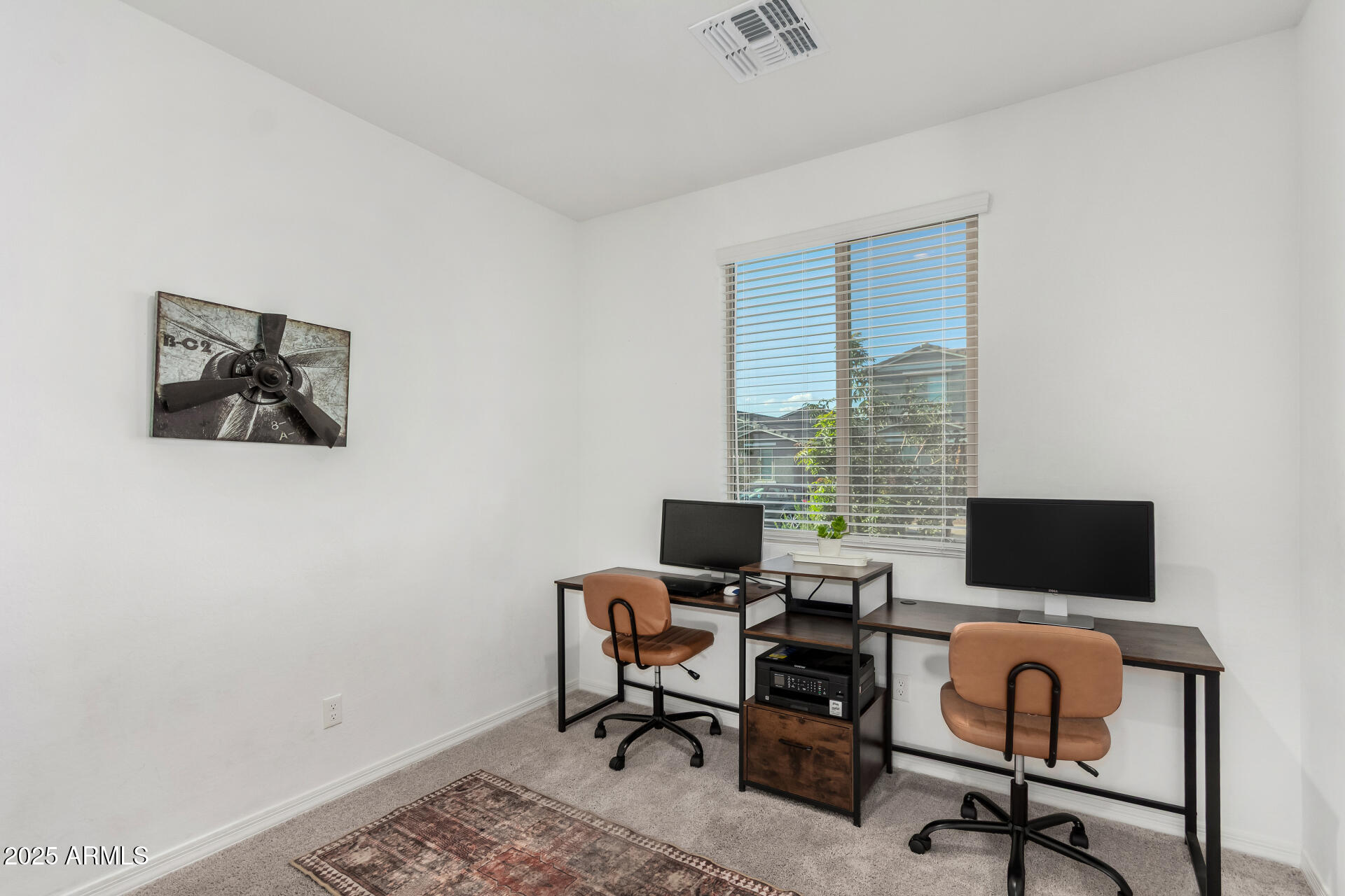 11517 East Unity Avenue Mesa, AZ 85212 - Photo 25 of 48 a view of a workspace with furniture and a window