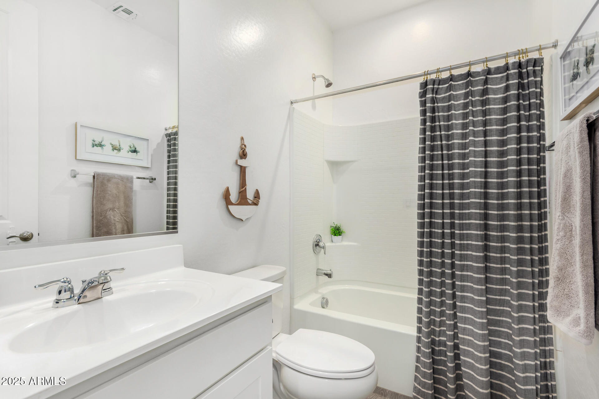 11517 East Unity Avenue Mesa, AZ 85212 - Photo 28 of 48 a bathroom with a bathtub shower sink vanity and toilet