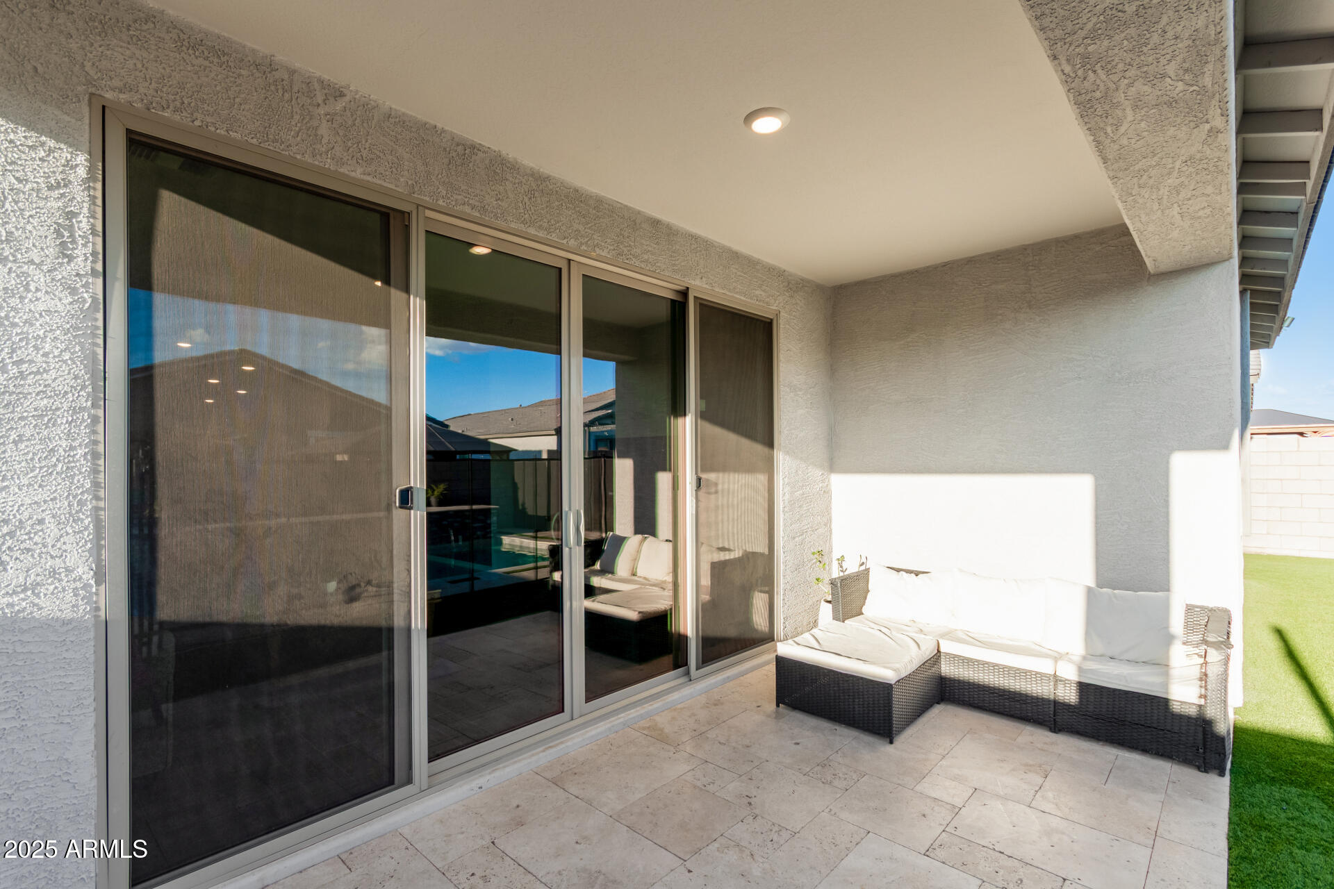 11517 East Unity Avenue Mesa, AZ 85212 - Photo 41 of 48 a living room with furniture and a glass door shower