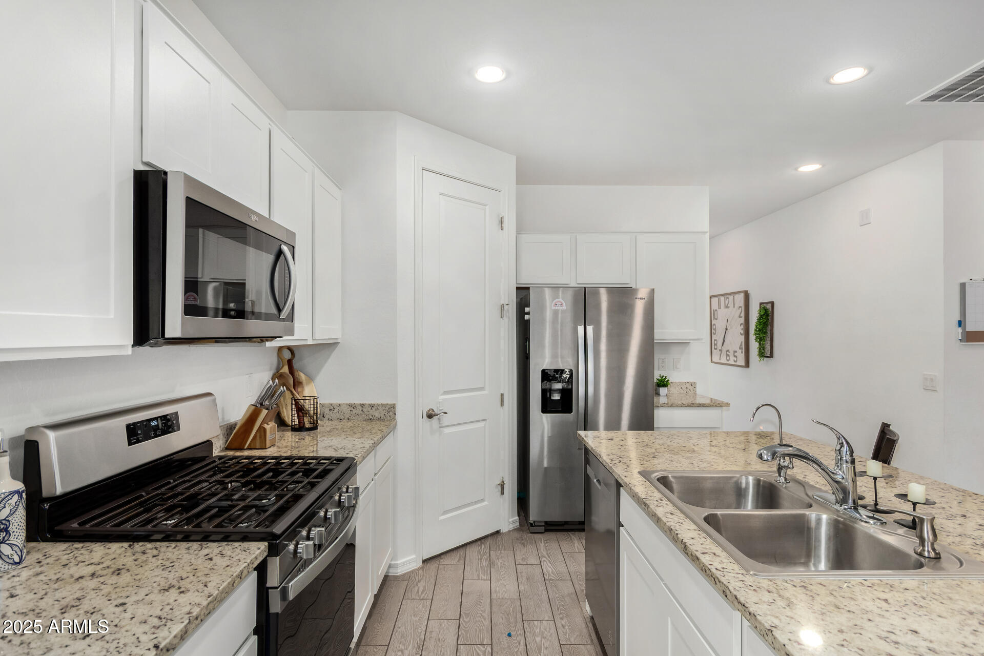 11517 East Unity Avenue Mesa, AZ 85212 - Photo 10 of 48 a kitchen that has a sink and a refrigerator