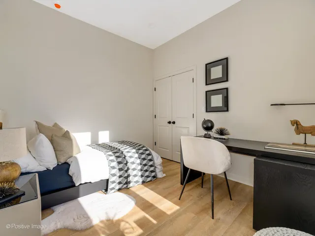 a bedroom with a bed and a couch