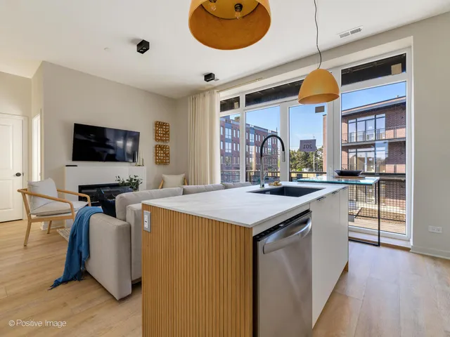a kitchen with stainless steel appliances granite countertop a sink and cabinets