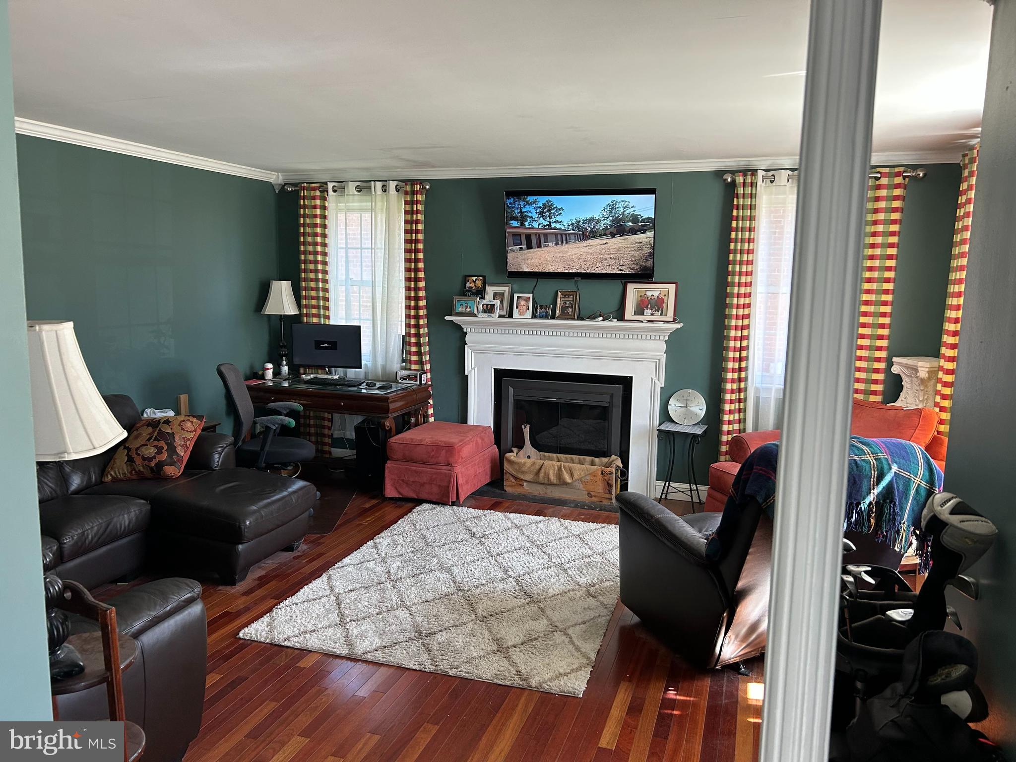 2217 Westview Drive Silver Spring, MD 20910 - Photo 3 of 4 a living room with furniture fireplace and flat screen tv