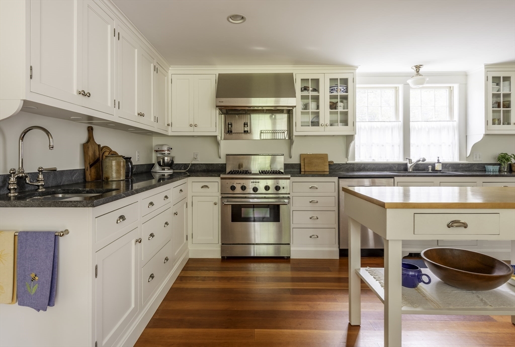 43 Middle Street Concord, MA 01742 - Photo 12 of 27 a kitchen with granite countertop white cabinets and white appliances