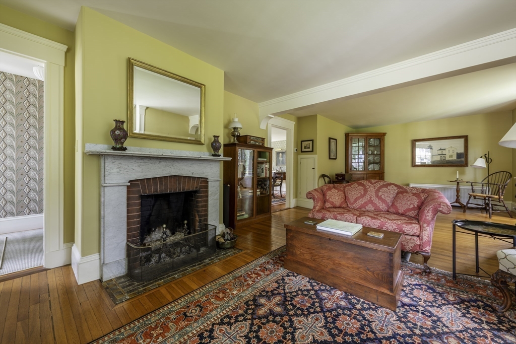 43 Middle Street Concord, MA 01742 - Photo 15 of 27 a living room with furniture and a fireplace