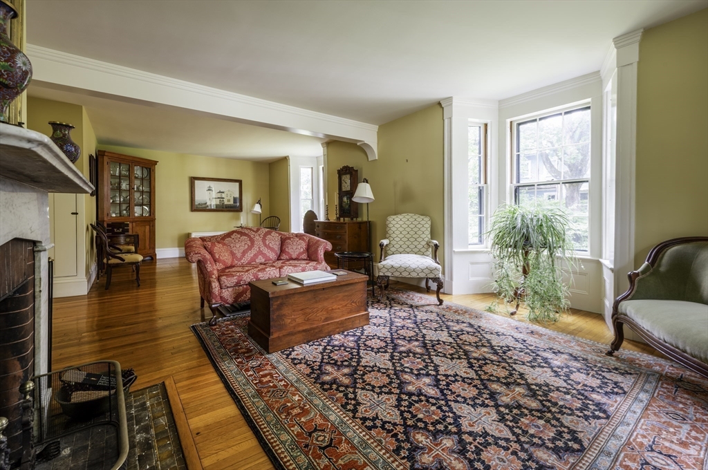 43 Middle Street Concord, MA 01742 - Photo 16 of 27 a living room with furniture and a wooden floor
