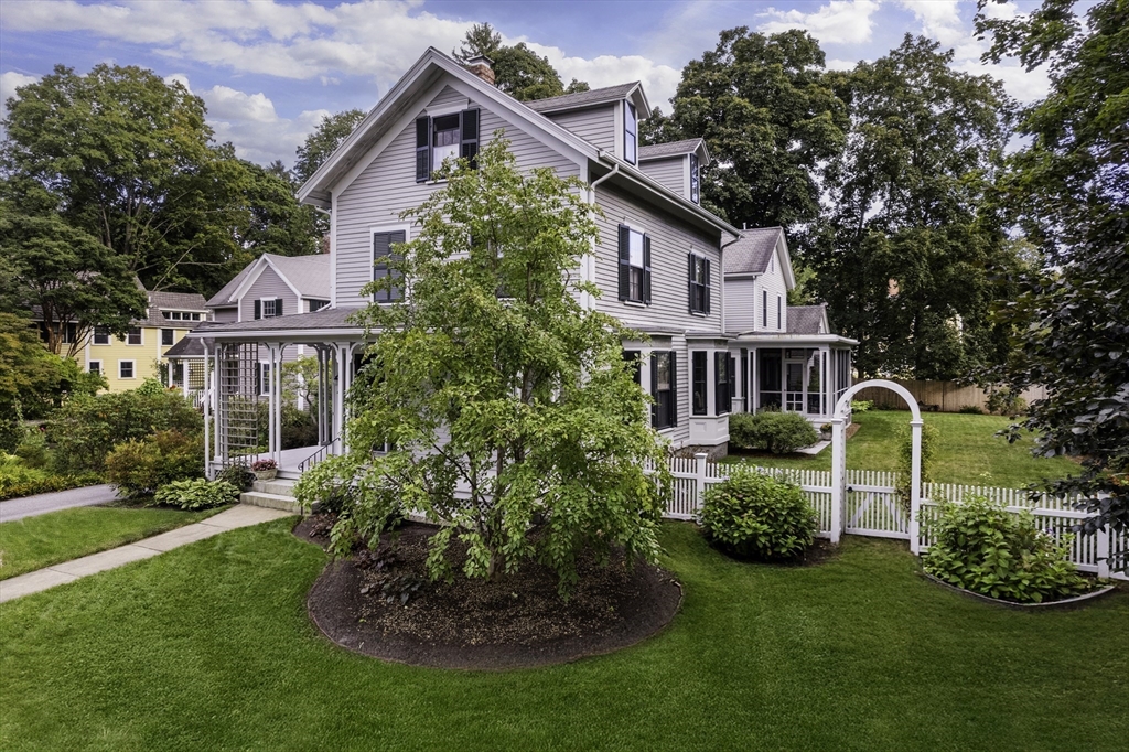 43 Middle Street Concord, MA 01742 - Photo 2 of 27 a front view of a house with a garden