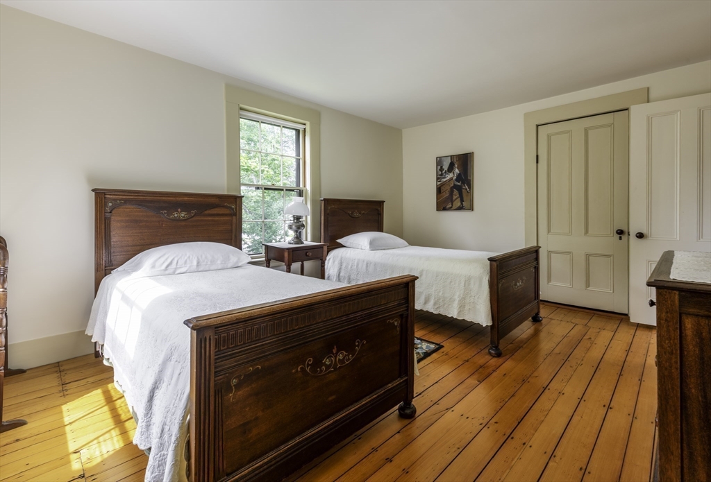 43 Middle Street Concord, MA 01742 - Photo 23 of 27 a spacious bedroom with two beds and wooden floor