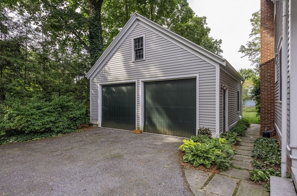 43 Middle Street Concord, MA 01742 - Photo 26 of 27 a view of a house with a yard and potted plants