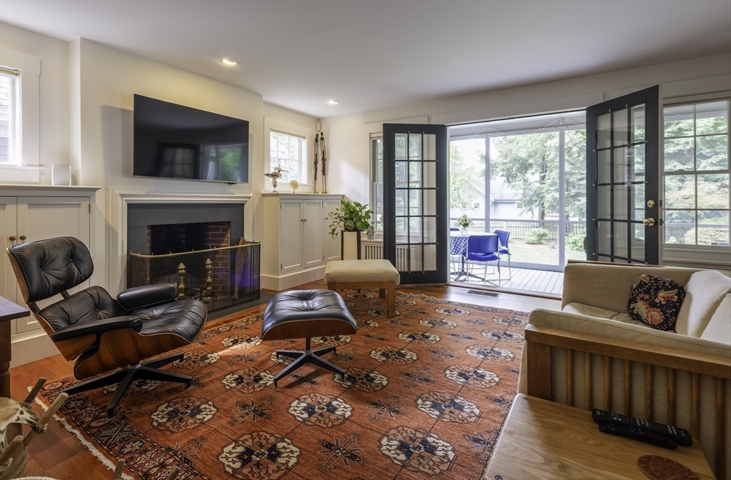 43 Middle Street Concord, MA 01742 - Photo 5 of 27 a living room with furniture a fireplace and a flat screen tv