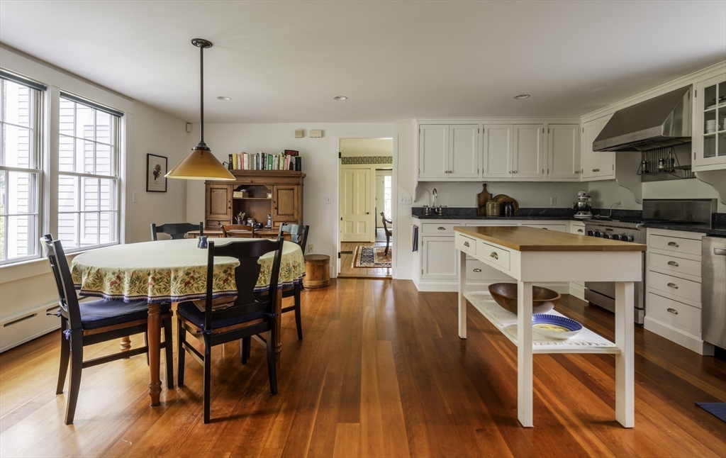 43 Middle Street Concord, MA 01742 - Photo 9 of 27 a view of a dining room with furniture a chandelier and wooden floor
