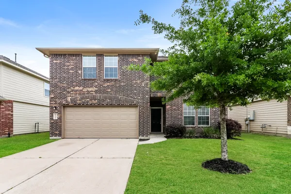 a kitchen with stainless steel appliances a sink and a stove