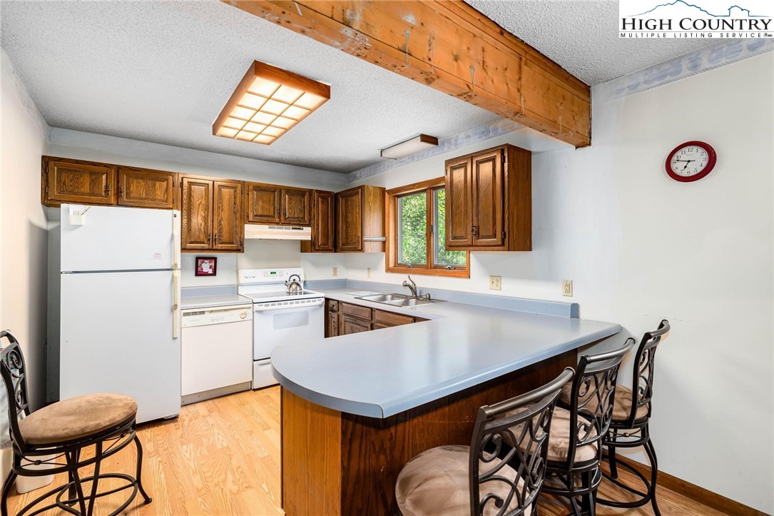 424 Poga Road Butler, TN 37640 - Photo 17 of 40 a kitchen with a refrigerator a stove a sink and a refrigerator