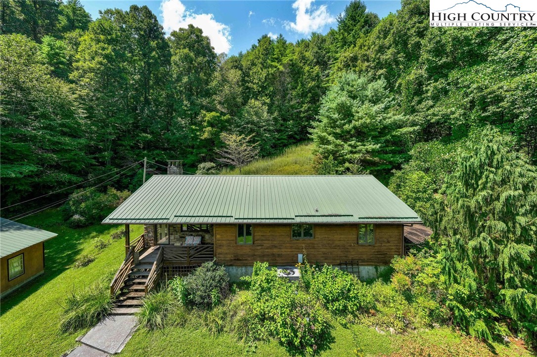424 Poga Road Butler, TN 37640 - Photo 2 of 40 an aerial view of a house with yard